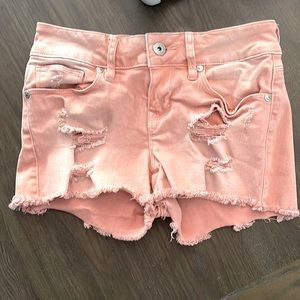 Guess by G light pink distressed shorts with frayed raw hem